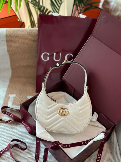 Gucci GG Marmont Half-Moon Shaped Mini Bag.